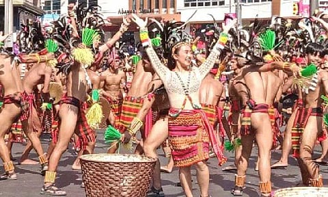 FESTIVAL PREP. Tourists walk along Session Road in Baguio City in this file photo. Tourism officials are urging visitors to book only with accredited establishments for the upcoming Panagbenga festival to avoid accommodation scams. (PNA photo by Liza T. Agoot)