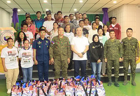 ZAMBOANGA. Thirty-one former rebels pose for a photo with Brigadier General Samuel Yunque, 102nd Infantry Brigade commander (fourth from left, front row), and Zamboanga del Norte Governor Darel Dexter Uy (fourth from right, front row) after receiving their safe conduct passes during a ceremony on Thursday, January 22, in Dipolog City.