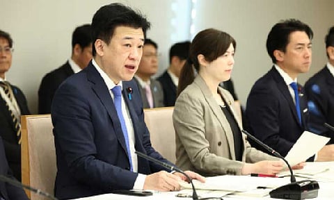 STRICTER RULES. Chief Cabinet Secretary Minoru Kihara (left) speaks at a meeting of related ministers to review policies on foreign nationals at the prime minister's office Friday (Jan. 23, 2026). The Japanese government adopted a package of measures to address problems related to foreign nationals, including planned stricter rules on their acquisition of Japanese land and nationality. (Jiji Press)