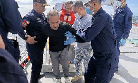 SURVIVORS. Philippine Coast Guard personnel assist a survivor of the sunken M/V Devon Bay in Pangasinan on Sunday (Jan. 25, 2025). The Chinese Coast Guard turned over to PCG 15 survivors and two deceased Filipino crew members of the cargo vessel, which reportedly capsized about 141 nautical miles west of Pangasinan, within the Philippines’ exclusive economic zone on Jan. 23. (Photo courtesy of PCG)