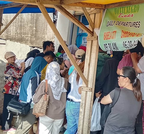 ZAMBOANGA. Passengers crowd the ticketing office of Montenegro Shipping Lines in Isabela City, Basilan, to secure tickets for travel to Zamboanga City after the Department of Transportation suspended the entire passenger fleet of Aleson Shipping Lines following the sinking of one of its vessels on Monday, January 26, off Hadji Muhtamad, Basilan province.