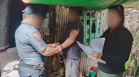 ILOILO. Police personnel from the Antique Police Provincial Office and Libertad Municipal Police Station escort the province’s ninth most wanted person after his arrest for four counts of acts of lasciviousness in Barangay San Roque, Libertad, Antique on January 28, 2026.