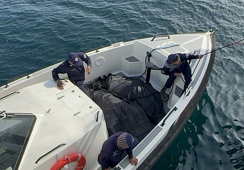ZAMBOANGA. Philippine Coast Guard personnel bring to Isabela City for identification procedures the bodies of two more passengers of the ill-fated Trisha Kerstin 3 they recovered on Friday, January 30, in the waters of Hadji Muhtamad, Basilan province.