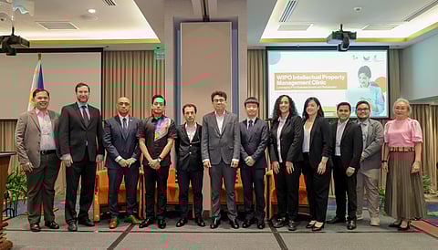 IPOPHL and WIPO officials, together with IP experts, pose on stage during the IPMC kick-off with participating MSMEs.