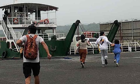 RUSH FOR LAST TRIPS. Commuters clutching different sizes of bags hurry across Sasa Wharf in Davao City on Thursday, February 5, scrambling to catch the final trips to Island Garden City of Samal and Talicud Islands before the Philippine Coast Guard suspended sea travel due to rough conditions brought by Tropical Storm Basyang. All operations resumed the next day, February 6, as weather and sea conditions improved, with authorities urging passengers to remain alert and follow safety advisories.