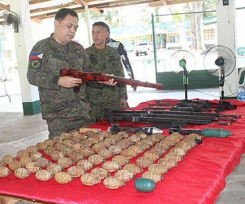 ZAMBOANGA. Brigadier General Yasser Bara, commander of the 101st Infantry Brigade (left), inspects the cache of firearms and explosives surrendered by eight individuals on Saturday, February 7, in Matalin village, Malabang, Lanao del Sur.