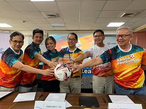 ABOITIZ CUP 25TH SEASON IN DAVAO. From left, Ernesto Ortonio Jr., president of the Davao South Regional Football Association; Welfredo Dalumpines of the Aboitiz Foundation, Inc.; Liza Kriztel Dureza-Valencia, organizer of CR7 Food Truck Football Club; Arman Valencia, tournament director of CR7 Food Truck Football Club; and Enriczar T. Tia, president and CEO of Davao Light and Power Co., Inc., lead the ceremonial ball presentation during the press conference launching Aboitiz Football Cup Season 25 in Davao City Friday, February 13, 2026.