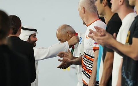 MOST BEMEDALLED. Ahmed Hamada receives his fifth gold medal in the men’s 85+ swimming competition of the Open Masters Games Abu Dhabi 2026 (OMGAD) at the Abu Dhabi Aquatics Club on Saturday (Feb. 14, 2026). Hamada is an 87-year-old swimmer from Egypt. (PNA photo by Avito Dalan)