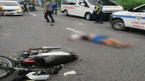 Woman dies after truck hits motorcycle