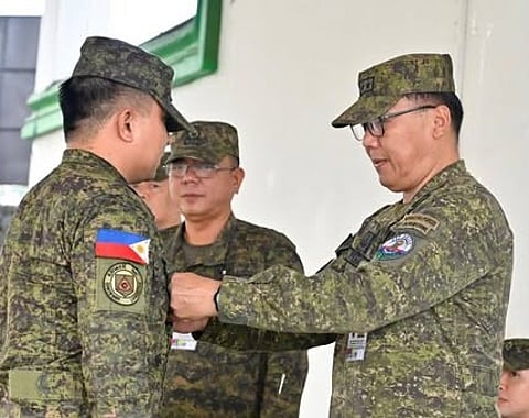 ZAMBOANGA. Major General Leonardo Peña, commander of the 11th Infantry Division (right), leads the donning of rank ceremony on Monday, March 9, at Camp Teodulfo Bautista in Jolo, Sulu, as the command promotes five lieutenants to the rank of captain.