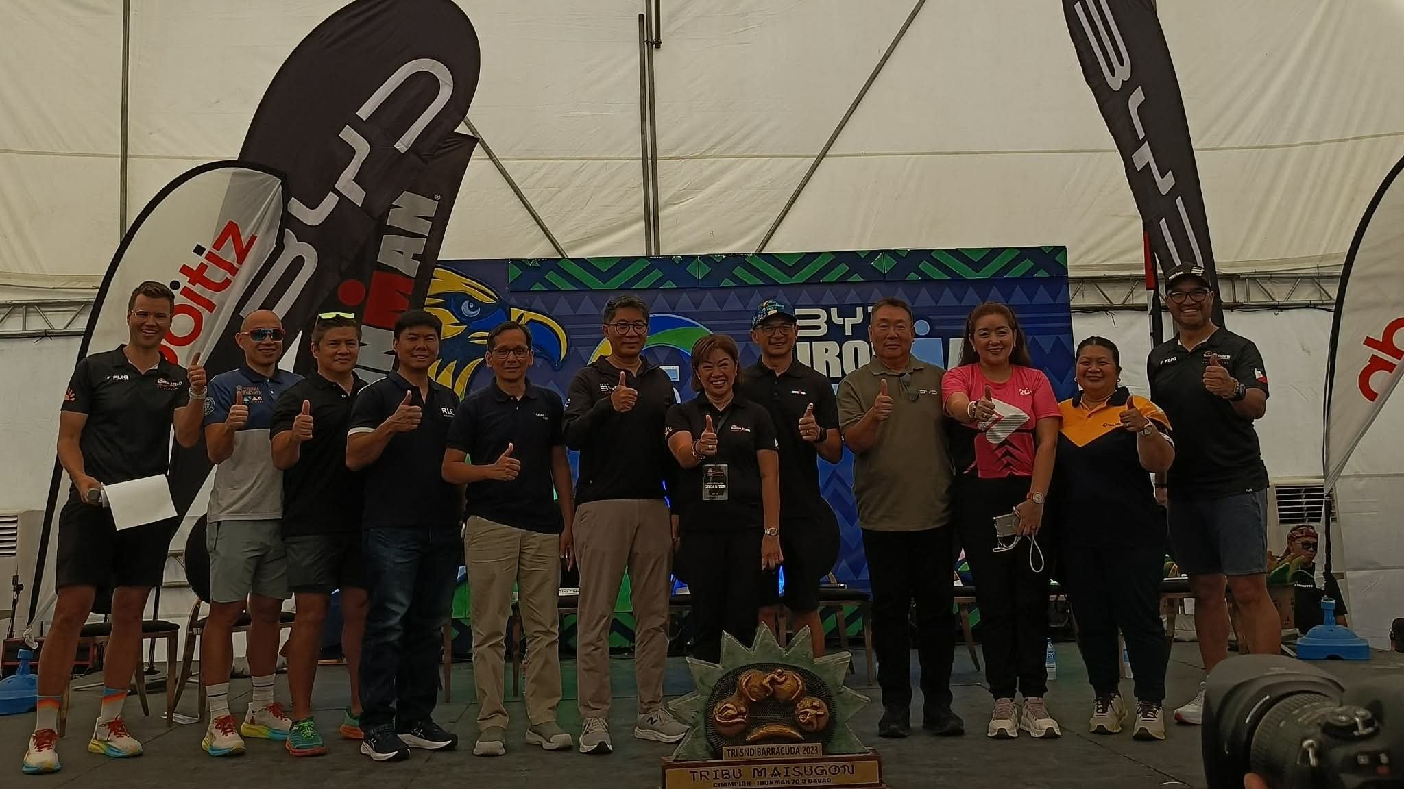 ALL SYSTEMS GO. Davao City officials, Sunrise Events Inc. and Ironman Group executives, and sponsors give a thumbs-up as the BYD Ironman 70.3 Davao press conference wraps up Friday at Bago Aplaya Coastal Road Esplanade.