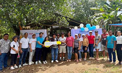 KEY OF RESPONSIBILITY. Aboitiz Foods and World Vision formally turn over the Project Omelette egg production livelihood kits to the CoMSCA groups in Siayan, Zamboanga Del Norte, with the key of responsibility symbolizing the community’s stewardship of the initiative.