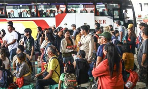 EXODUS. Passengers intending to spend the holidays in the provinces crowd a bus terminal in Cubao, Quezon City on Dec. 20, 2025. The same scenario is expected as the country commemorates the Holy Week this year. (PNA file photo by Joan Bondoc)