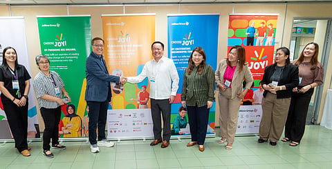 Industry-Education Collaboration. Joseph Tanbuntiong, chief executive officer of Jollibee Brand Global (4th from left), shakes hands with director Marc Magsalin of the Department of Education (5th from right) to formally launch the Jollibee Group–DepEd partnership to co-develop a Senior High School Quick Service Restaurant (QSR) curriculum and Work Immersion Program. The collaboration aims to equip students with future-ready skills, strengthen employability, and deepen education–industry alignment in support of nation-building.