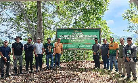 FDC Misamis Representative Manuel Kionisala (4th from left), CMU field researchers led by Dr. Jose Hermis Patricio (3rd from right), and Sambulawan Barangay Captain Paul Valmoria (6th from left) at the project site during the carbon mapping and accounting activities.