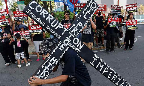 Progressive groups Bagong Alyansang Makabayan (BAYAN)-Southern Mindanao and Kadamay-Davao, along with other sectoral organizations, call for a halt to oil price hikes and denounce government inaction on poverty and corruption during a protest on Tuesday, March 31, 2026, at Freedom Park in Davao City.