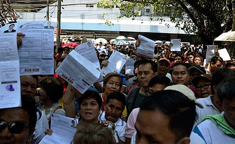 MANILA. Some of the candidates for the May 14 Barangay and SK elections show their certificates of candidacy outside the Commission on Elections office on Arroceros St., Manila. (Alfonso Padilla/SunStar Philippines)