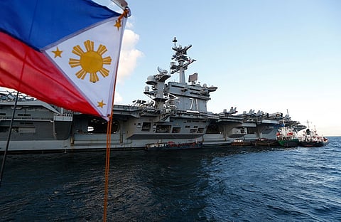 MANILA. U.S. aircraft carrier Theodore Roosevelt (CVN-71) and several escort ships sailed in the South China Sea in a display of America's naval might during the Chinese sea drills. It later visited Manila and hosted government and military officials and businessmen in a reception Friday night.(AP Photo)