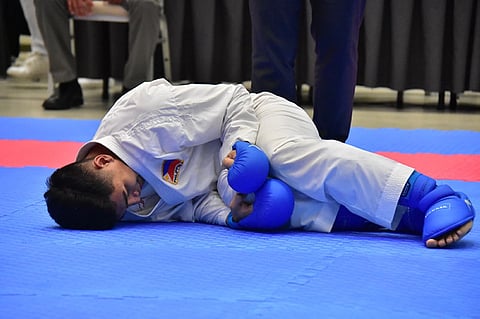 CEBU. This was how defending champion Rexor Tacay of Davao City, right, hurt his knee during the senior men's -67 kilograms quarterfinals match against Dagupan City's Jude Michael Uson, 5-3, in the Philippine National Games 2018 at the SM Seaside Sky Hall in Cebu City on Thursday, May 24. (Macky Lim)