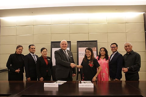 Launch partners. Standing from left are Waterfront Cebu City Hotel and Casino (WCCHC) marketing communications officer Karen D. Hassim, WCCHC marketing communications manager Arnel Aparis, WCCHC convention and events director Fila Sophia Ubalde-D'Lonsod, WCCHC general manager Anders Hallden, Moments unit manager Iris Nikki C. Oguis, Moments editor-in-chief Meyen Baguio, Moments managing editor Michael Vincent Bacatan and Moments publishing editor Bong Abela.