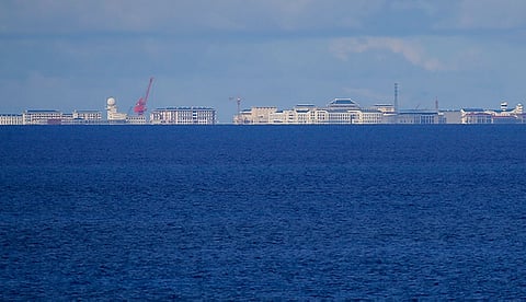 MANILA. In this April 21, 2017, file photo, Chinese structures and buildings on the man-made Subi Reef at the Spratlys group of islands are seen from the Thitu Island off the South China Sea. (AP)