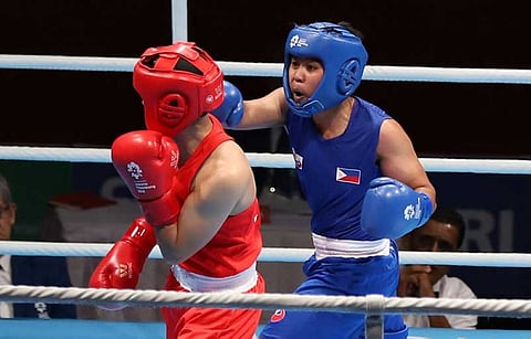 DAVAO. Nesthy Alcayde Petecio of the Philippines unleashes a power punch against Chinese Junhua Yin. (PSC PHOTO)