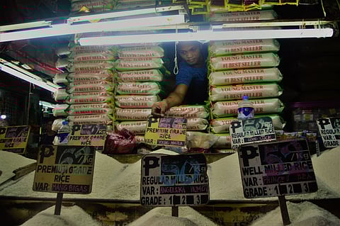 CAGAYAN DE ORO. A storekeeper tends to the rice on display at the Cogon public market as prices of this staple has soared, while the release of thousands of bags of imported rice was delayed by the Bureau of Customs in Northern Mindanao due to the volume of goods that came in recently. (Jigger J. Jerusalem)