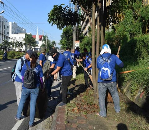 PAMPANGA. Employees of Balibago Waterworks System, Incorporated clean Don Juico Avenue in Barangay Malabanias Angeles City in support of the nationwide clean up drive spearheaded by the EMB. (Photo Courtesy of Marwin Manaloto)