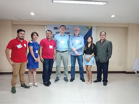 DAVAO. Attorney Romel Bagares receives his certificate of recognition after his discussion and reaction about federalism in the Philippine context. (Lyka Amethyst Casamayor)