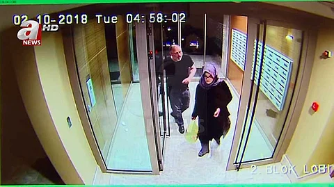 TURKEY. In this image taken from CCTV video that emerged Monday Oct. 22, 2018, purportedly showing Saudi writer Jamal Khashoggi and his fiancee, Hatice Cengiz, at an apartment building in Istanbul, Turkey, just hours before his death in the Saudi Arabian Consulate. The video was broadcast by the pro-Turkish government Turkish television channel A News, and was said to be obtained via Turkey's security sources. (A News via AP)