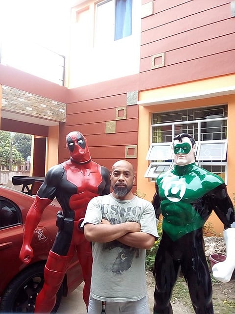 CAGAYAN DE ORO. Demver Morales together with the life-size statues of superheroes he created. (Photos from Demver Morales' Facebook account)