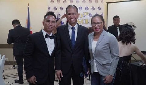 DAVAO. Catalino Diaz, Jr., left, is the cousin and first coach of Rio Olympics silver medalist Hidilyn Diaz, right. Both attend the Ateneo de Davao University 5th Coaches' Banquet at the Apo View Hotel Saturday evening. Also in photo is Addu athletics director Noli Ayo. (Photo courtesy from Hidilyn Diaz Oly Facebook page)