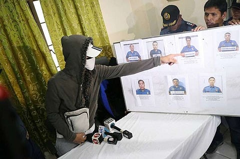 MANILA. A witness identifies the police officers involved in extortion from drug suspects. (NCRPO Photo)