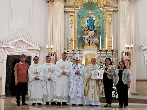 PAMPANGA. National Museum's Cultural Properties Regulation Division deputy chief Raquel Flores, and National Museum's Cultural Properties Regulation Division Administrative officer Carmencita Mariano together with the Regent of Metropolitan Cathedral of San Fernando Rectoral Council Charles Espiritu, Administrator Reverend Fr. Recarthy Macalino, Reverend Fr. Emil Guiao, Vicar General Reverend Fr. Francis Hizon, Archbishop Emeritus Paciano Aniceto, Archbishop Florentino Lavarias in posterity after they signed the declaration of Metropolitan Cathedral as an 'important cultural property' on Tuesday. (Nicole Renee David)