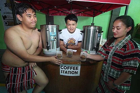 BAGUIO. La Trinidad tourism officer Valred Olsim join the youth garbed in traditional attire during the opening program of La Trinidad Coffee festival slated on February 7-10 with the theme "Brewing Unity through Coffee 2019." The public is encouraged to bring their own mugs on February 9 for the unlimited coffee at the park. (Jean Nicole Cortes)