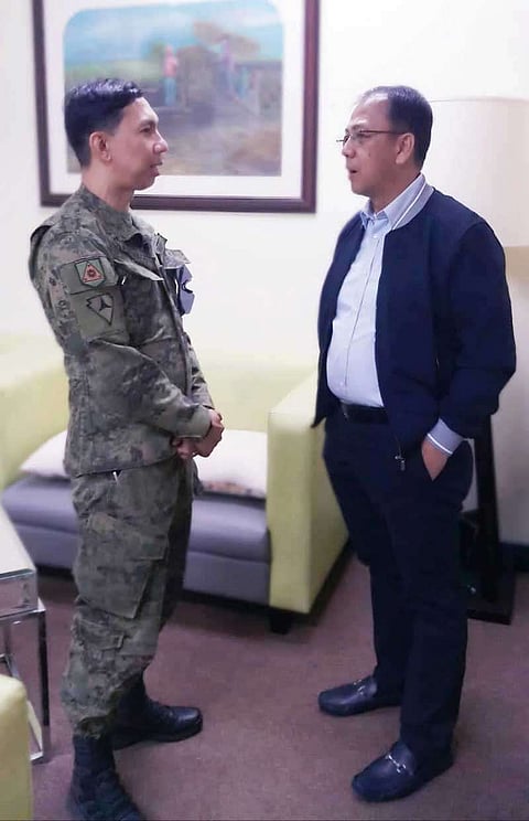 NEGROS. Colonel Benedict Arevalo and Office of the Presidential Adviser on the Peace Process Sec. Carlito Galvez discuss localized peace talks in Negros. (Contributed photo)