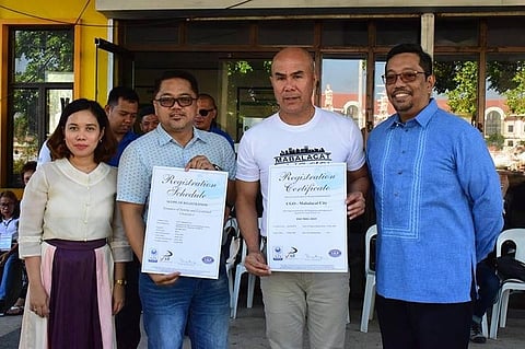 Mabalacat City Mayor Cris Garbo and City Administrator chief Rosan Paquia receive from AJA Registrars president Paul Bagatsing and Business Development and Client Relations manager Laarni Narido the ISO 9001:2015 certification the City Planning and Development Office earned for instituting standards on zoning and location clearance. (SunStar Pampanga)