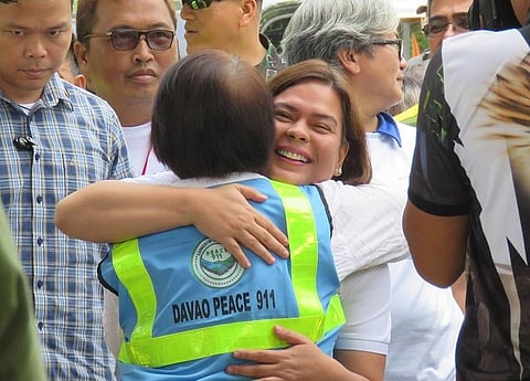 In this file photo, then-Davao City Mayor, now Vice President Sara Z. Duterte gave then-City Adviser for Peace Irene M. Santiago a tight hug while thanking her for the gains achieved in Paquibato over a period of one year during the mayor's arrival for the 1st anniversary celebration of Davao City's Peace 911, a local initiative to put an end to communist insurgency in 2019.