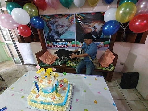 AKLAN. Albert Manalo with one of his dogs during the birthday celebration Tuesday, June 4, 2019. (Jun N. Aguirre)