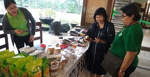 BACOLOD. Agriculture Undersecretary Evelyn Laviña (center) with Department of Agriculture - Western Visayas director Remelyn Recoter (right) checks the products of rural-based organizations participating in the three-day 5th Farm Home Extensionists Association of the Philippines (Fhexap) National Congress at the Nature's Village Resort starting Tuesday, August 6, 2019. (Photo by Erwin P. Nicavera)