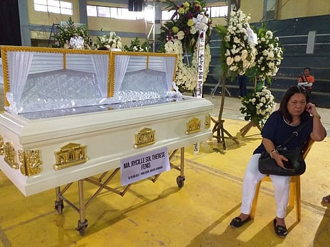 ILOILO. Cecilia Fenis at the Guimaras Provincial Multipurpose Gym where the body of her daughter, Reycille Sol Therese Fenis, was housed Wednesday, August 7, 2019. (Carolyn Abello)