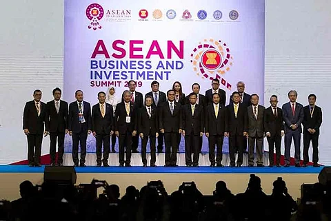 THAILAND. Thailand Prime Minister Prayuth Chan-ocha, front center, poses for pictures with businessmen after a speech at the Asean Business and Investment Summit in Nonthaburi province, Thailand, Saturday, November 2. (AP)