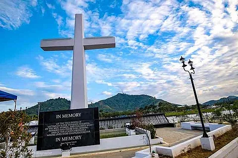 TACLOBAN. The mass gravesite in Barangay Basper, Tacloban City where storm survivors offer holy mass and wreaths for those who died during the Super Typhoon Yolanda in November 8, 2013. (Photo by Elmer Eclipse)