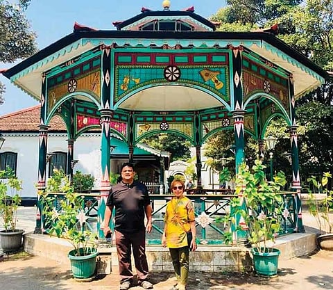 Shem and the author stood by the Dutch-inspired pavilion at the Royal Sultan Palace. (Photo by Debb Bautista)