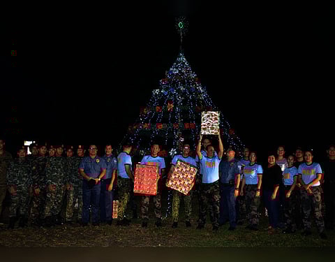 PAMPANGA. Personnel of the Angeles City Police Office rejoice after lighting the 20-foot Christmas tree on Wednesday, December 4, 2019. (Contributed photo)