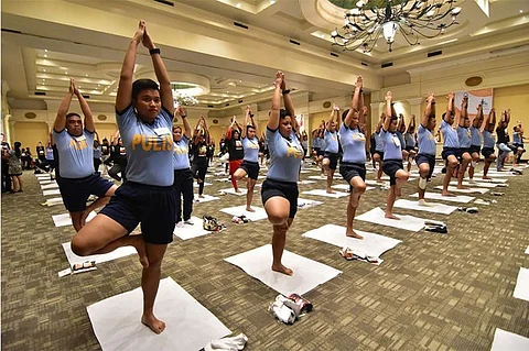 POLICE YOGA. Members of the Davao City Police Office execute the tree pose as they participate during last Sunday afternoon's International Yoga Day 2018 celebration together with 400 other participants at the Davao Convention Center in Davao City.