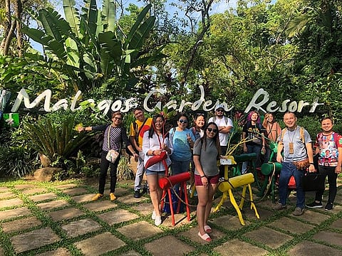 DAVAO. Bloggers and media colleagues pose for a final group photo before leaving Malagos Garden Resort. (Photo by Doris Mongaya)