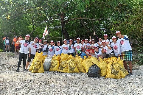 ILOILO CITY. Reef Wanderers Conservation Advocates Executive Director Julius Tagomata (far right) with officers and volunteers, mostly professionals and now conservationist, during coastal clean-up at Nogas Island, Anini-y, Antique on December 22, 2019. (Photo by Leo Solinap)