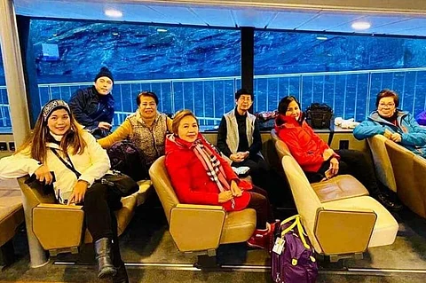 NORWAY. Relaxing inside a liner that brought us on a fjord tour are: Arlene S., Erwin, Emma, the author, Genie, Arlene M., and Zeny. (Photo by Debb Bautista)