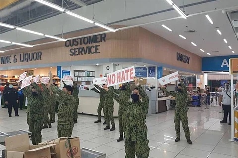 PAMPANGA. Members of the Philippine National Police in Central Luzon conducts information dissemination at the SM Supermarket inside SM City Pampanga. (Contributed photo)